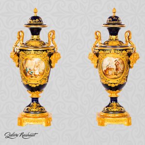 Pair of French sevres style vases with bronze handles and pedestals
