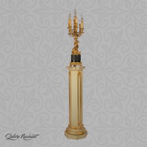 A column pedestal topped with lamp