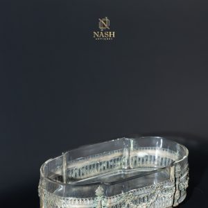 crystal centerpiece framed in finely chased gilt bronze, the faceted glass body